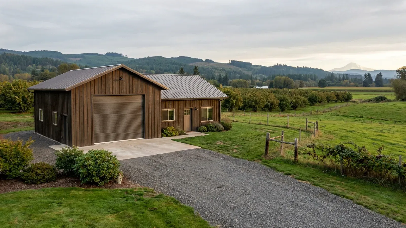 A barndominium with a tall, deep RV garage bay attached to the residence under one continuous roof.